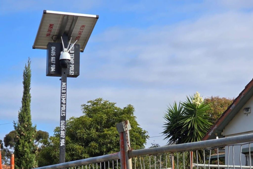 Solar site security camera mounted and operational at a remote job site